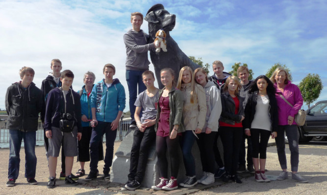 Special connection: the Norwegian visitors at the Montrose statue of famous St Bernard Bamse.