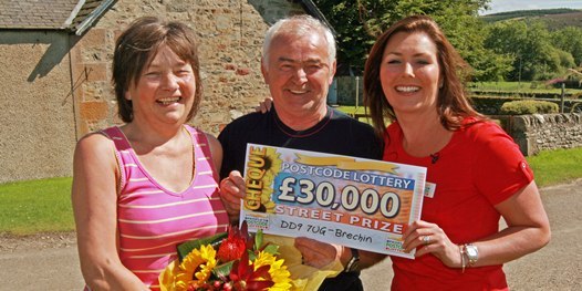 Bob Douglas, Courier. Left, Violet and Michael Strachan of Clochie Farm Cottages, Glen Lethnot, are presented with their £30,000 cheque by Judy McCourt of Postcode Lottery.