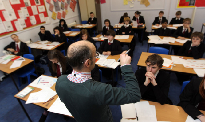 Teacher during a History lesson at Pittville High School, Cheltenham
February 8 2012.
PA Photo : David Davies.