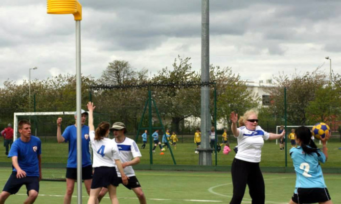 Terri Lloyd defends while players jockey for position under the post.