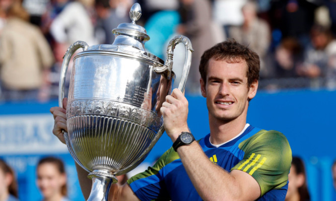 Andy Murray celebrates his victory against Marin Cilic in the final of the AEGON Championships at The Queen's Club, London. PRESS ASSOCIATION Photo. Picture date: Sunday June 16, 2013. See PA story TENNIS Queen's. Photo credit should read: Jonathan Brady/PA Wire