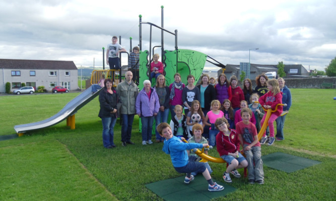 Children, members of the Davidson Park Action Group and Councillor Gaul at the revamped playpark.