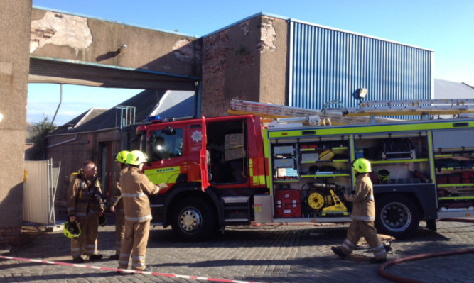 Fire crews at the scene of the blaze at Maxwelltown Works.