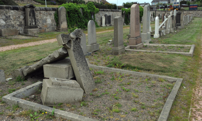 A fallen gravestone in Kinghorn cemetery.