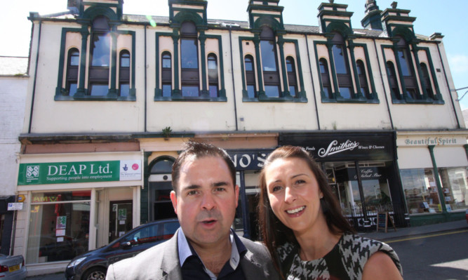 Graeme and Leanne Carling outside the Keptie Street flats.