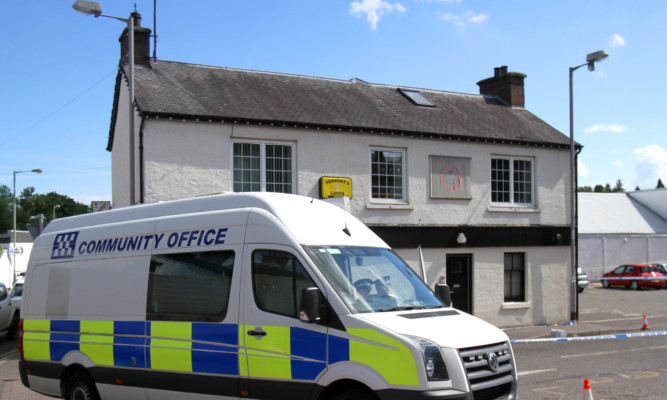 Police outside the Crown Bar in Blairgowrie following the incident.