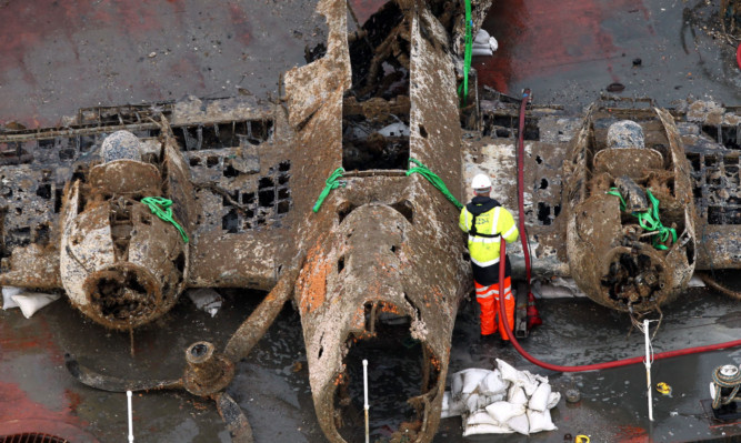 Conservation staff have started cleaning the German Second World War Dornier 17 bomber at the RAF Museum in Cosford.