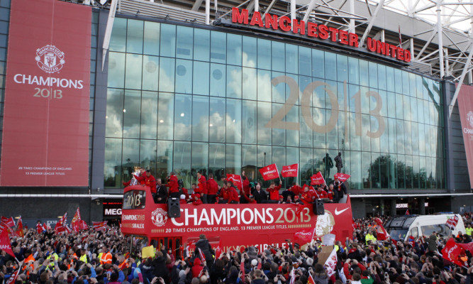 Manchester United players celebrating their title victory last season.