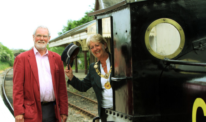 Provost Helen Oswald with Andrew Webster, chairman of Caledonian Railway, on the refurbished platforms at Bridge of Dun station.