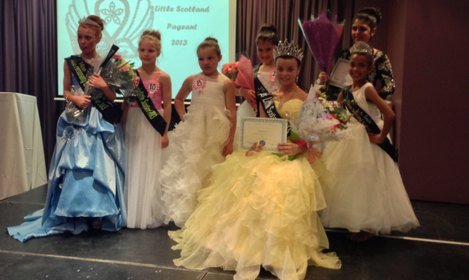 Elise, seated front, with other competitors in the pageant.