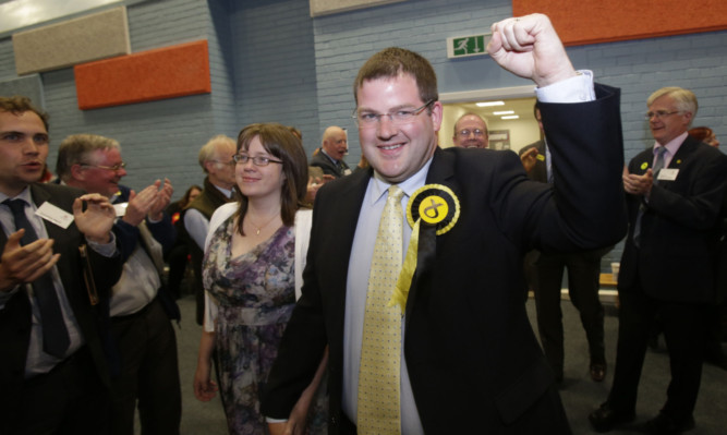 Winning SNP candidate Mark McDonald arrives at the count with his wife Louise.
