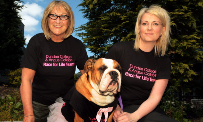 Angus College deputy principal Jackie Howie and Genna Ferguson with Martha.