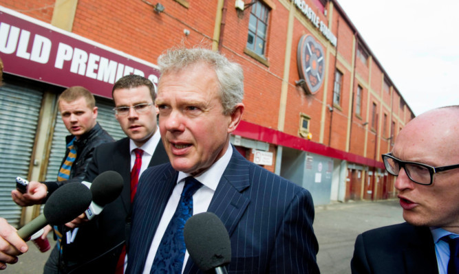 Administrator Trevor Birch is surrounded by the media as he arrives at Tynecastle.