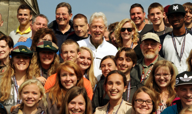 Mr Clinton meeting locals and a party of US exchange students after his round of golf in St Andrews on Friday.