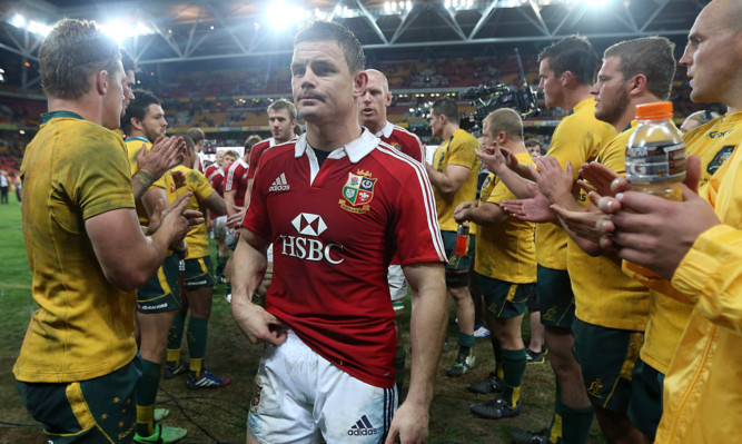 Brian O'Driscoll and the Lions walk through the Australian guard of honour at full-time.