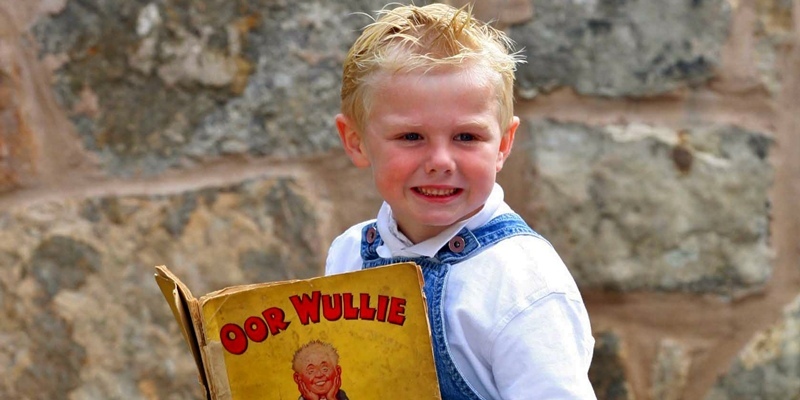 Gareth Jennings,Sunday Post....Eddie McVey and  Aiden McVey (5)as oor Wullie, with his rare oor Wullie annual,words Rob