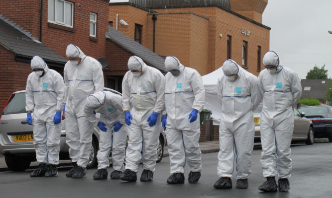 Forensic officers outside the mosque in Walsall.