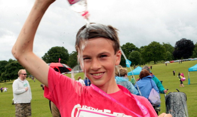 Jude Hughes cools down after winning the Race for Life.