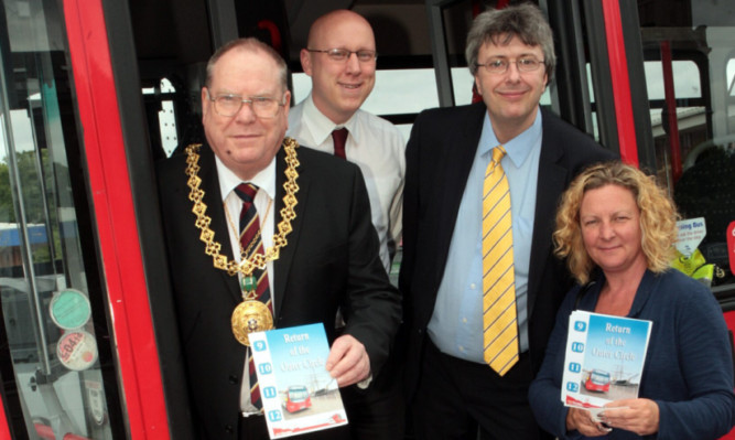 Mr Duncan, Mr Clark, National Express Dundee managing director Phil Smith and Angie Hasting, community officer, at the launch of the new timetable.