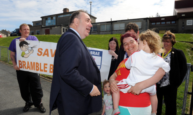 Mr Salmond speaking to parents outside Bramble Brae Primary School in June.