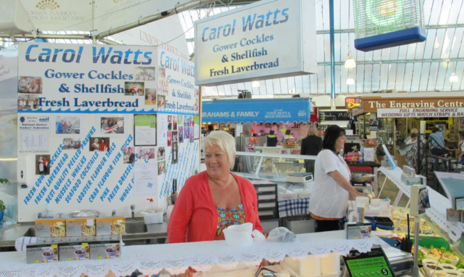 A seafood stall offers up some local favourites at a bustling Swansea Market.