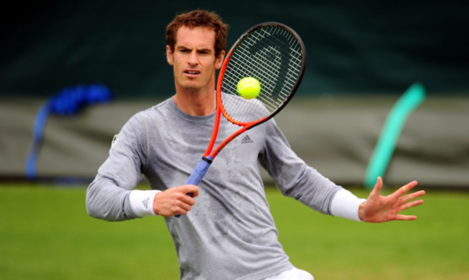 Andy Murray practices during day four of the Wimbledon Championships.