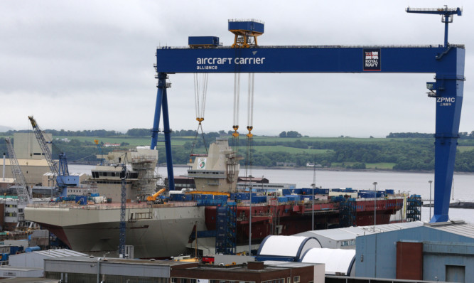 The AFT island is  lowered into place.