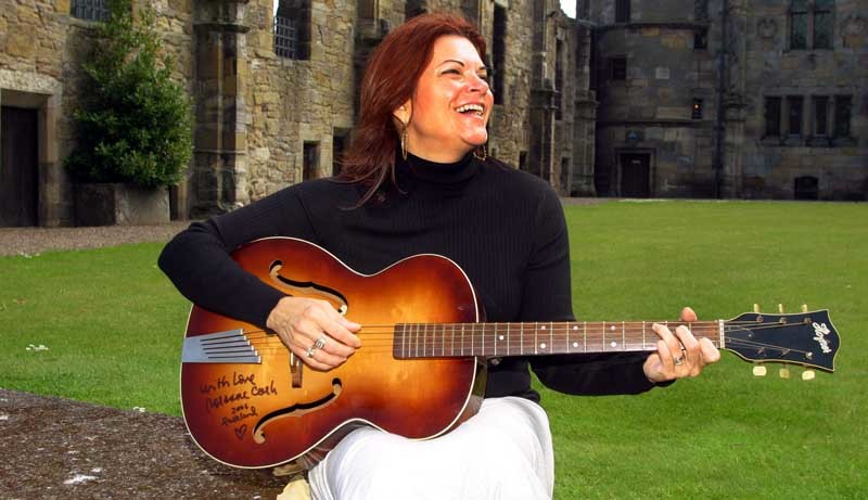 Roseanne Cash, daughter of the legendary country singer Johnny Cash who was at Falkland Palace today to launch the Big Tent Festival. The guitar she is playing was donated to her by local violin shop owner Bob Beveridge, Rosanne promptly signed it and asked for it to be raffled for a local charity.  It is an acoustic Hofner from the 1950's and is identical to the one her dad played from his early days and is featured in the film 'Walk the Line'.