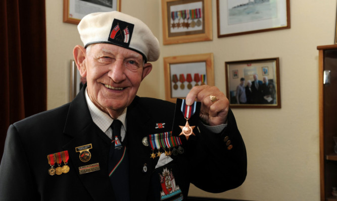 Tom Lennie of Newburgh with his medal.