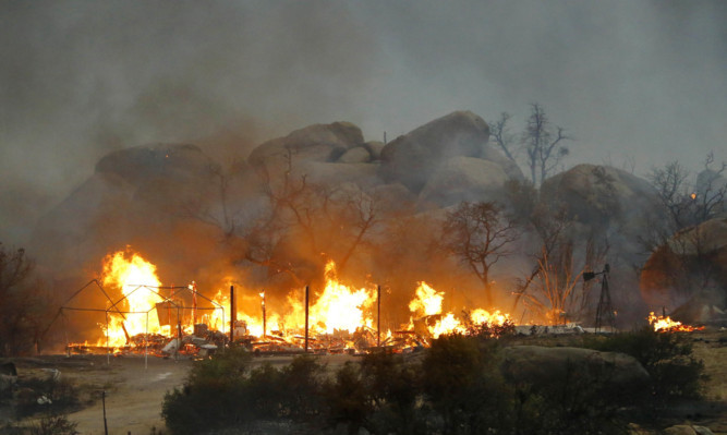 Homes burn as the Yarnell Hill Fire burns in Glenn Ilah, Arizona.