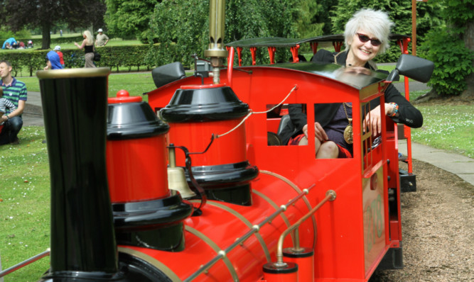Fife Depute Provost Kay Morrison at the controls of the train in Craigtoun Park.
