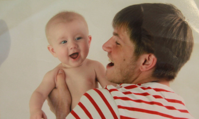 Robbie Low with his baby son Jack.