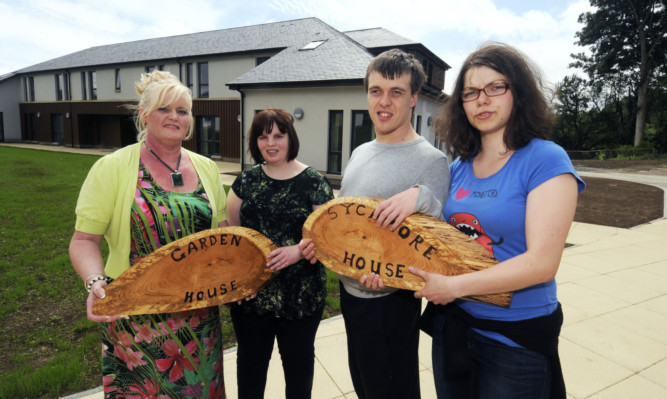 From left: support worker Dianne Stevenson, residents Leanne Kenny and Sam Thomson and co-worker Michaela Friedrich.