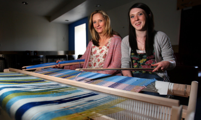 Dawn Mullady, left, and Adele Douglas at one of the looms at the Pitstop in Forfar.