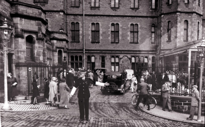 A policeman stands at the gates of Dundee Royal Infirmary in 1954. 