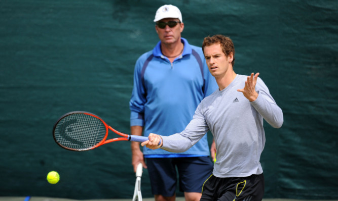 Andy Murray is watched by his coach Ivan Lendl during a practice session.