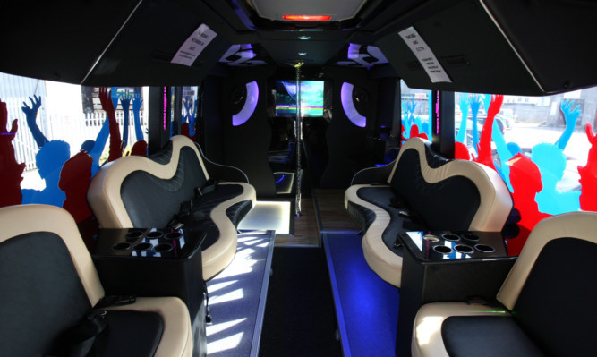 The interior of Tele Taxis  new bus that includes a 42" TV and a dance floor.