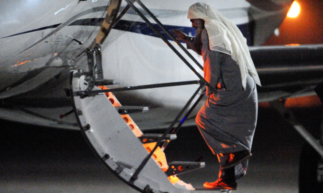 Abu Qatada boards the plane at RAF Northolt.