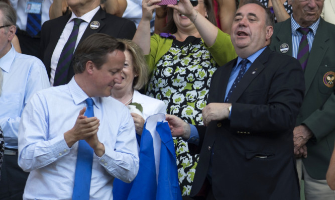 David Cameron turns round to see Alex Salmond flying the flag.
