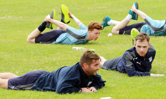 Dundee players including Peter McDonald (front) and Carlo Monti (right) training at Riverside.