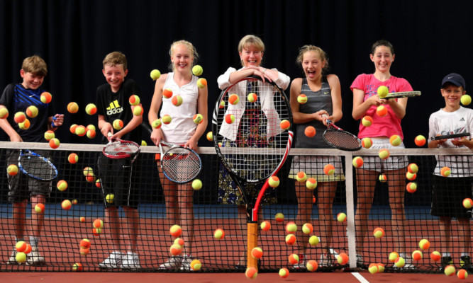 Shona Robison with young players at the Gannochy National Tennis Centre.
