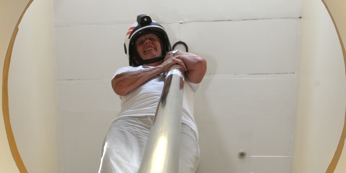 Kris Miller, Courier, 03/07/11. Picture today shows Cllr Helen Oswald at Blackness fire station who was touring various stations in Tayside to raise money for The Moira Fund. Pic shows Helen going down the firemans pole.