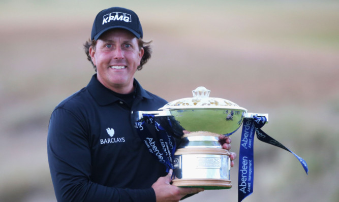 Phil Mickelson with the winner's trophy.