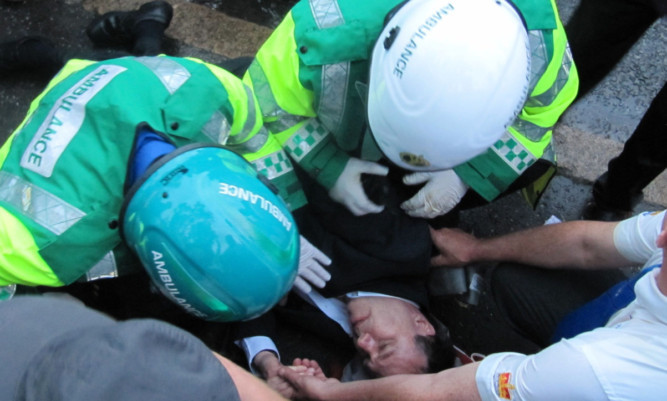 Medics treating Mr Dodds after he was struck.