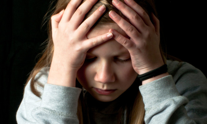 Charities warn of the stresses young carers face. (Photo posed by actor)