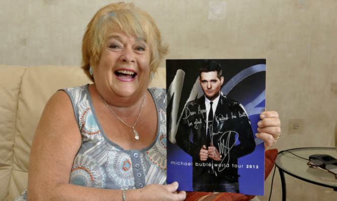Agnes with her signed Michael Buble programme.