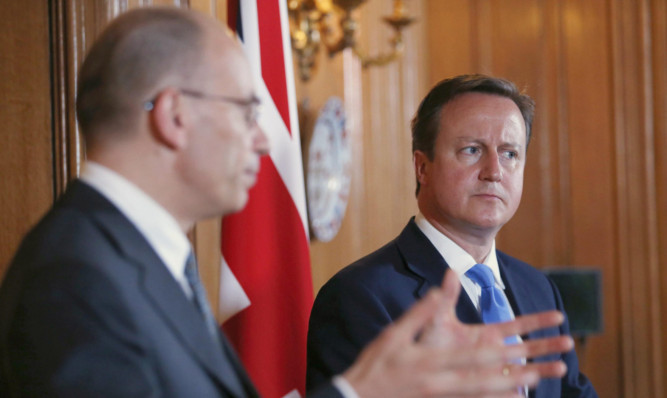 Italian Prime Minister Enrico Letta and David Cameron hold a joint news conference at 10 Downing Street.