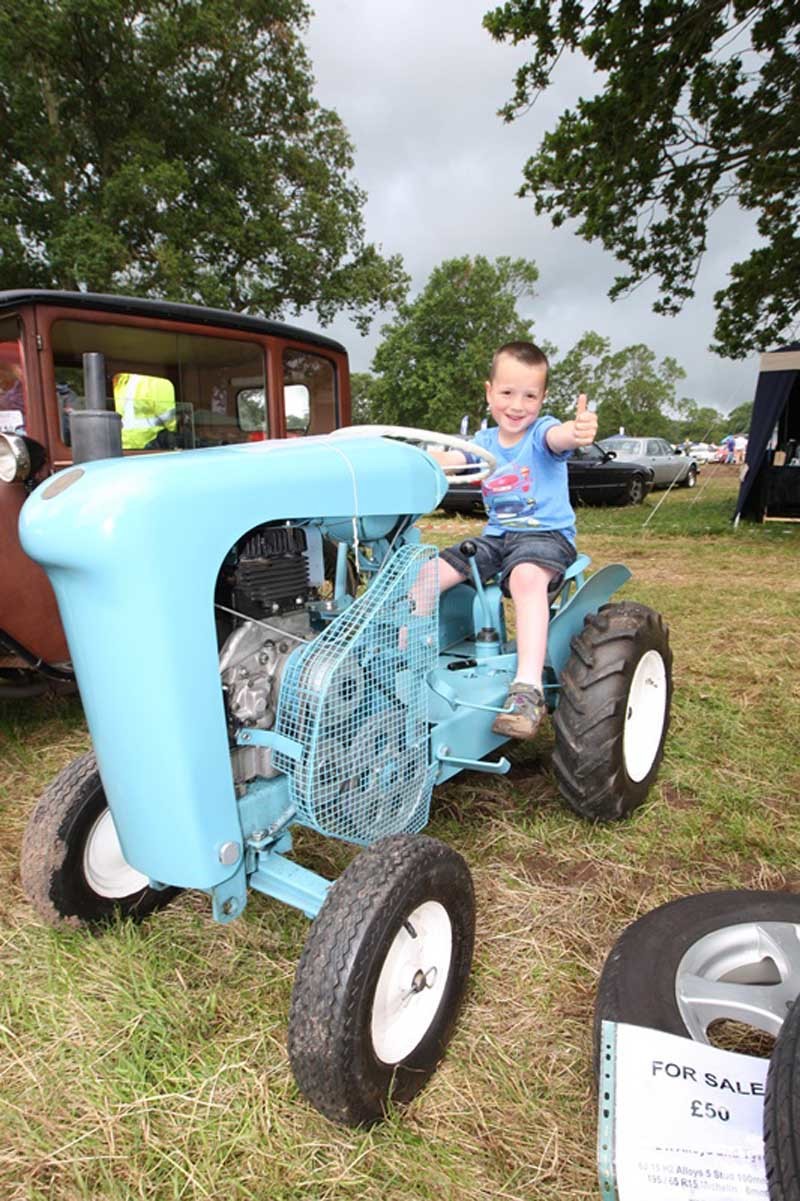 Steve MacDougall, Courier, Glamis Castle, Glamis. Scottish Transport Extravaganza. Scenes from the day. Pictured, Ewan Gordon (aged 6), sitting on a 'Unihorse Tractor', part of the 'Lea-Francis Owners Club'.