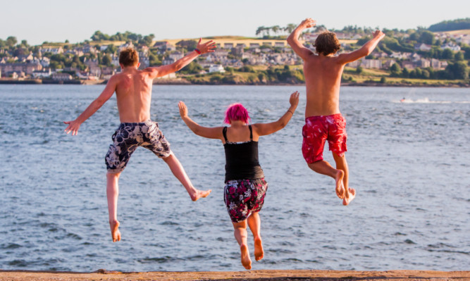 Youngsters jump into the water at Broughty Ferry to cool off during Thursday's scorcher.