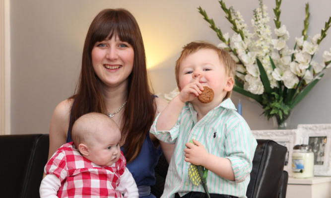 Skin cancer survivor Caroline Begg with son Oliver and daughter Isabelle.